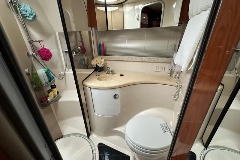 Beyond The Reef Yacht Photos Pics Luxurious bathroom in 2008 Regal Commodore 4060 yacht with modern amenities and elegant design.