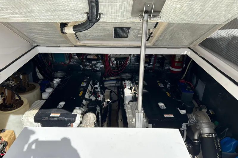 Beyond The Reef Yacht Photos Pics Engine compartment of 2008 Regal Commodore 4060 boat, showcasing dual engines and mechanical components.