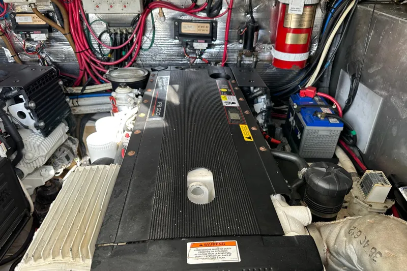 Beyond The Reef Yacht Photos Pics Engine room of 2008 Regal Commodore 4060 with wiring and components visible.