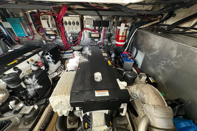 Beyond The Reef Yacht Photos Pics Engine room of 2008 Regal Commodore 4060 with wiring and components visible.