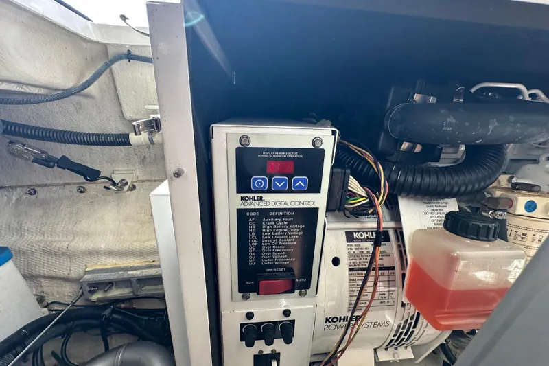 Beyond The Reef Yacht Photos Pics Kohler generator control panel in a 2008 Regal Commodore 4060 boat engine room.