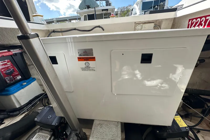 Beyond The Reef Yacht Photos Pics 2008 Regal Commodore 4060 boat engine compartment with fire extinguisher port.