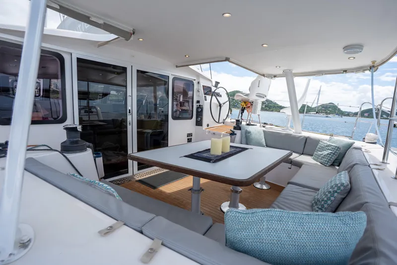 Inky Blue Yacht Photos Pics Spacious deck of 2020 Outremer 51 catamaran with comfortable seating and scenic ocean view.