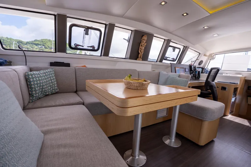 Inky Blue Yacht Photos Pics Luxurious interior of 2020 Outremer 51 catamaran with modern seating and decor.