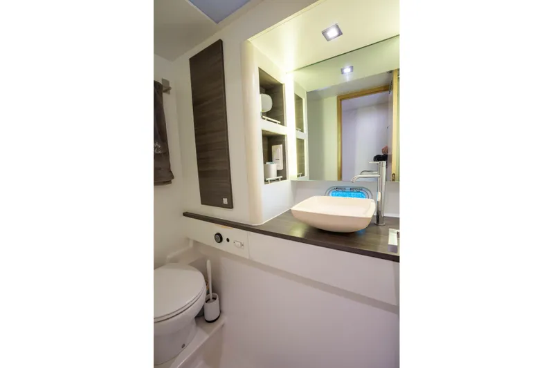 Inky Blue Yacht Photos Pics Modern bathroom in 2020 Outremer 51 yacht with sleek sink and toilet.