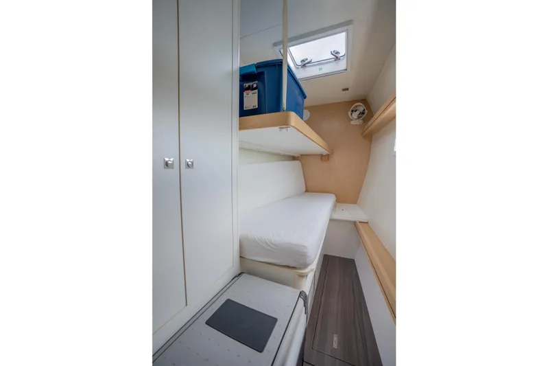 Inky Blue Yacht Photos Pics 2020 Outremer 51 yacht cabin with bunk beds and storage.