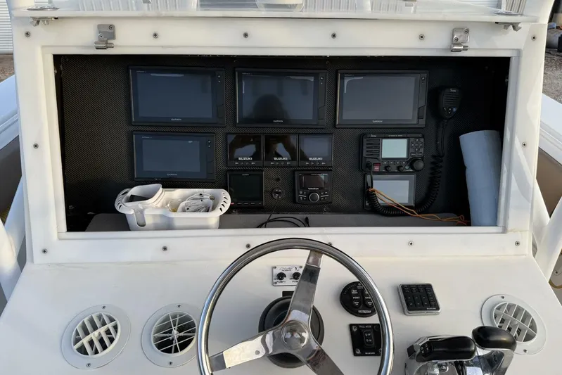 Pass It On Yacht Photos Pics 2014 SeaHunter 40 Tournament boat dashboard with multiple Garmin displays and controls.