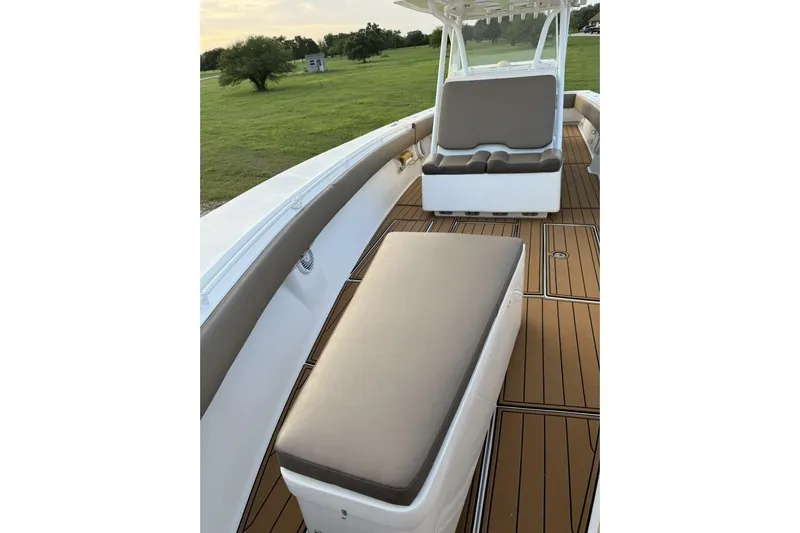 Pass It On Yacht Photos Pics 2014 SeaHunter 40 Tournament boat interior with cushioned seating and wooden deck.