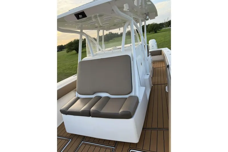 Pass It On Yacht Photos Pics 2014 SeaHunter 40 Tournament boat with cushioned seating and sleek deck design.