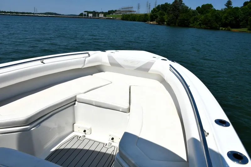  Yacht Photos Pics 2016 Boston Whaler 280 Outrage boat interior with seating, on a scenic lake.