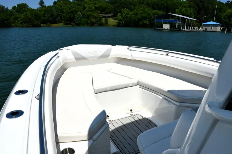  Yacht Photos Pics 2016 Boston Whaler 280 Outrage boat interior with white seating on a lake.