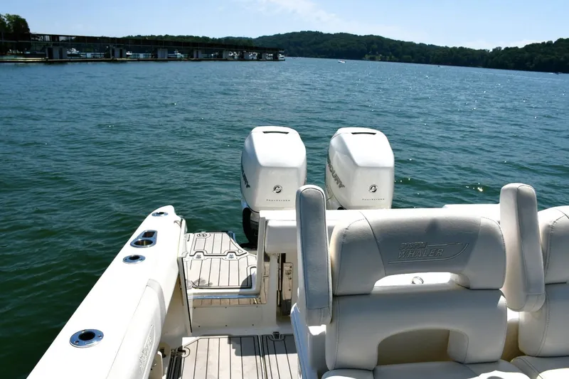  Yacht Photos Pics 2016 Boston Whaler 280 Outrage boat with twin engines on a sunny lake.