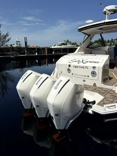 Salty Xperience Yacht Photos Pics 2020 Sea Ray 320 Sundancer OB Coupe docked, featuring triple Mercury outboard engines.