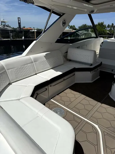 Salty Xperience Yacht Photos Pics Luxurious seating area on 2020 Sea Ray 320 Sundancer OB Coupe boat.