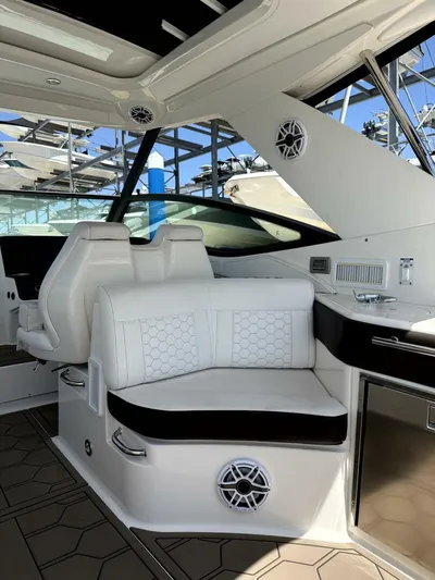 Salty Xperience Yacht Photos Pics Interior of 2020 Sea Ray 320 Sundancer OB Coupe with white seating and modern design.