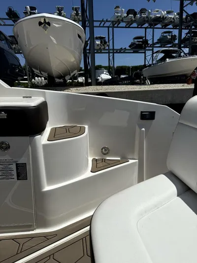 Salty Xperience Yacht Photos Pics 2020 Sea Ray 320 Sundancer OB Coupe interior with docked boats in background.