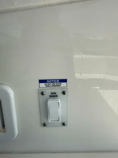 Salty Xperience Yacht Photos Pics Sun shade switch with notice on 2020 Sea Ray 320 Sundancer OB Coupe boat.