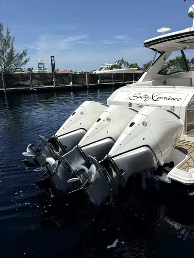 Salty Xperience Yacht Photos Pics 2020 Sea Ray 320 Sundancer OB Coupe with triple outboard engines docked.