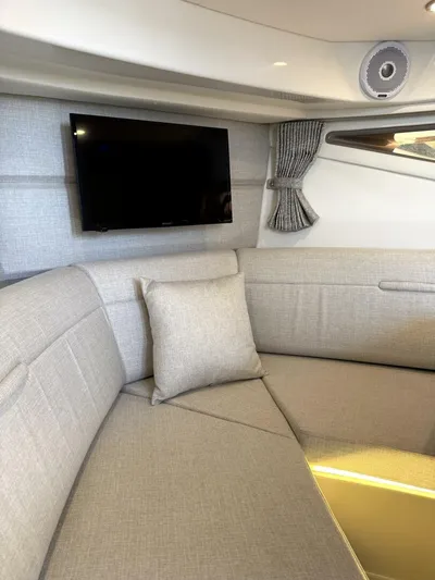 Salty Xperience Yacht Photos Pics Interior of 2020 Sea Ray 320 Sundancer OB Coupe with TV and plush seating.
