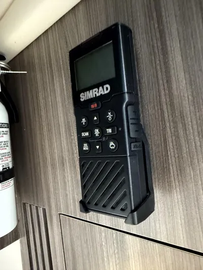 Salty Xperience Yacht Photos Pics Simrad marine radio mounted on 2020 Sea Ray 320 Sundancer OB Coupe interior panel.