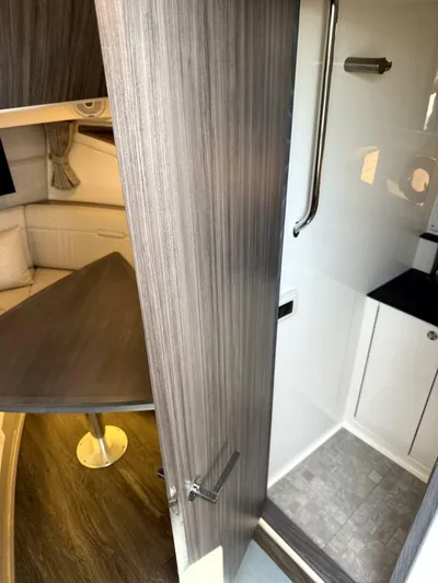 Salty Xperience Yacht Photos Pics Interior of 2020 Sea Ray 320 Sundancer OB Coupe, featuring cabin and bathroom.