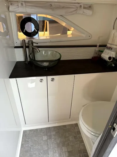 Salty Xperience Yacht Photos Pics Modern bathroom in 2020 Sea Ray 320 Sundancer OB Coupe with glass sink and porthole window.