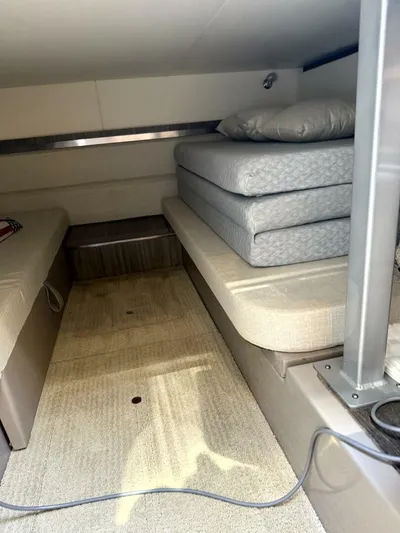 Salty Xperience Yacht Photos Pics Interior cabin of 2020 Sea Ray 320 Sundancer OB Coupe with cushioned seating.