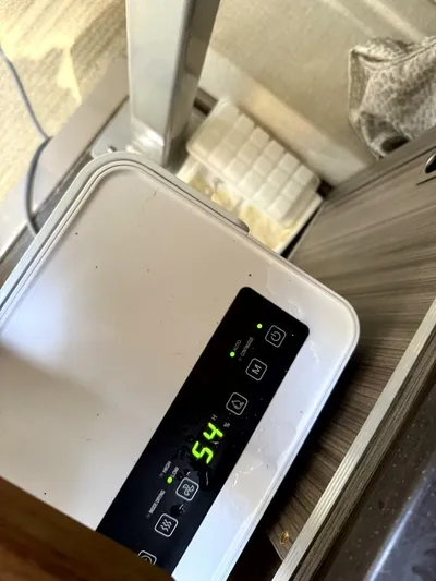 Salty Xperience Yacht Photos Pics Digital control panel on a Sea Ray 320 Sundancer OB Coupe, displaying 54% humidity.