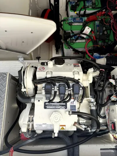 Salty Xperience Yacht Photos Pics Engine compartment of a 2020 Sea Ray 320 Sundancer OB Coupe with visible wiring and components.