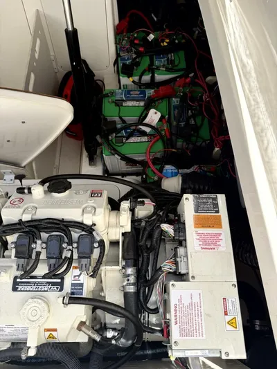 Salty Xperience Yacht Photos Pics Engine compartment of 2020 Sea Ray 320 Sundancer OB Coupe with visible wiring and components.