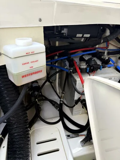 Salty Xperience Yacht Photos Pics Engine compartment of 2020 Sea Ray 320 Sundancer OB Coupe with Westerbeke coolant tank.