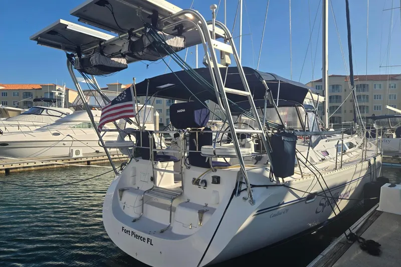 Spellbound Yacht Photos Pics Sailboat Catalina 470, 2000 model, docked at Fort Pierce, FL marina with solar panels.
