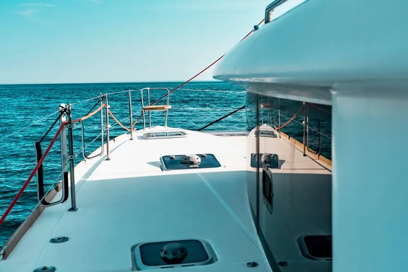  Yacht Photos Pics Lagoon 450 F catamaran deck view, 2016 model, sailing on open sea.