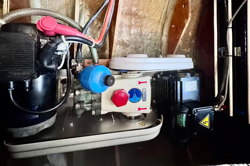  Yacht Photos Pics Engine compartment of a 2016 Lagoon 450 F catamaran, featuring mechanical components and wiring.