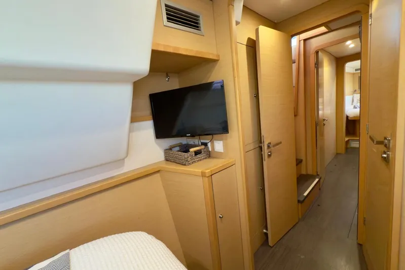  Yacht Photos Pics Interior of 2016 Lagoon 450 F yacht with modern wood finish and TV.