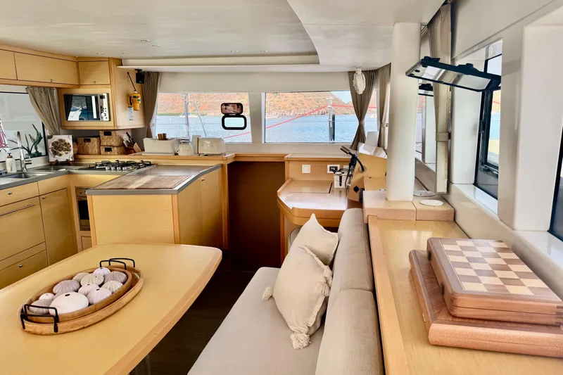  Yacht Photos Pics Interior of 2016 Lagoon 450 F yacht with modern kitchen and cozy seating area.