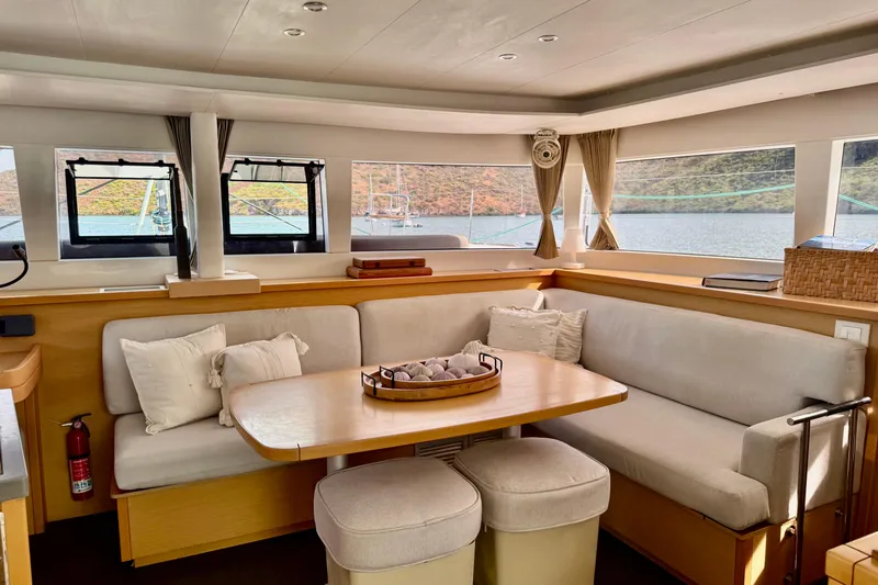  Yacht Photos Pics Interior of 2016 Lagoon 450 F catamaran with cozy seating and panoramic windows.