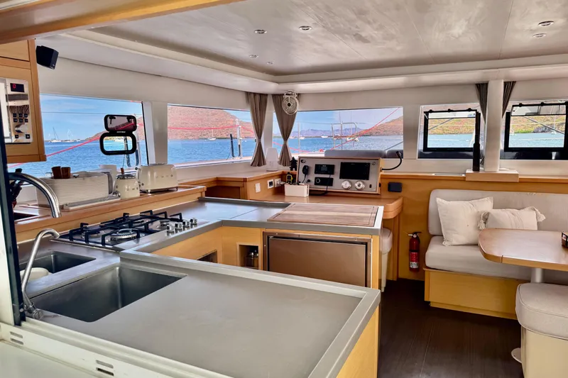 Yacht Photos Pics Interior of 2016 Lagoon 450 F catamaran with modern kitchen and ocean view.