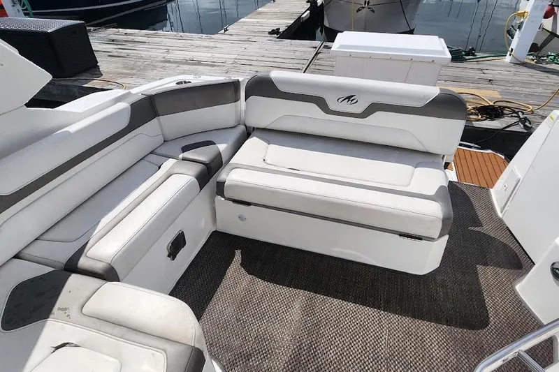 "magic Ten" Yacht Photos Pics 2015 Monterey 335 Sport Yacht interior seating with gray and white upholstery.