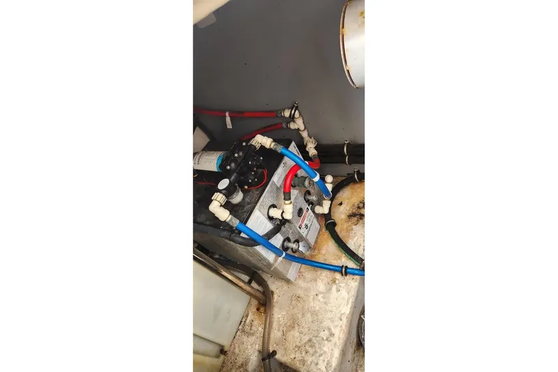 "magic Ten" Yacht Photos Pics Engine compartment of a 2015 Monterey 335 Sport Yacht with visible wiring and components.