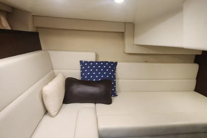"magic Ten" Yacht Photos Pics 2015 Monterey 335 Sport Yacht interior with beige seating and decorative pillows.