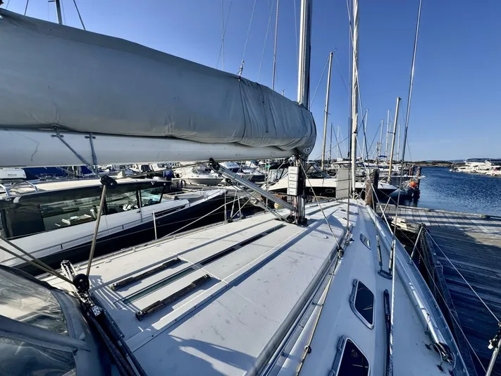  Yacht Photos Pics Sailboat Beneteau 45 First 1991 docked at marina, clear blue sky background.