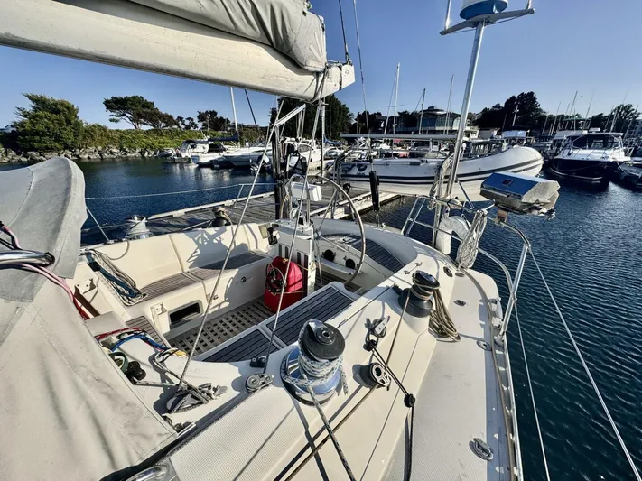  Yacht Photos Pics Sailboat Beneteau 45 First 1991 docked in marina, featuring spacious cockpit and rigging.
