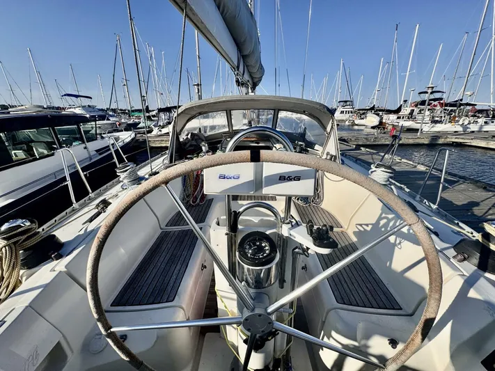  Yacht Photos Pics Sailboat cockpit view of 1991 Beneteau 45 First, docked in a marina.