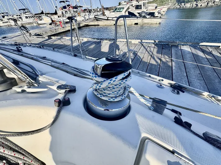  Yacht Photos Pics Sailboat deck with winch and rope, Beneteau 45 First, docked at marina.