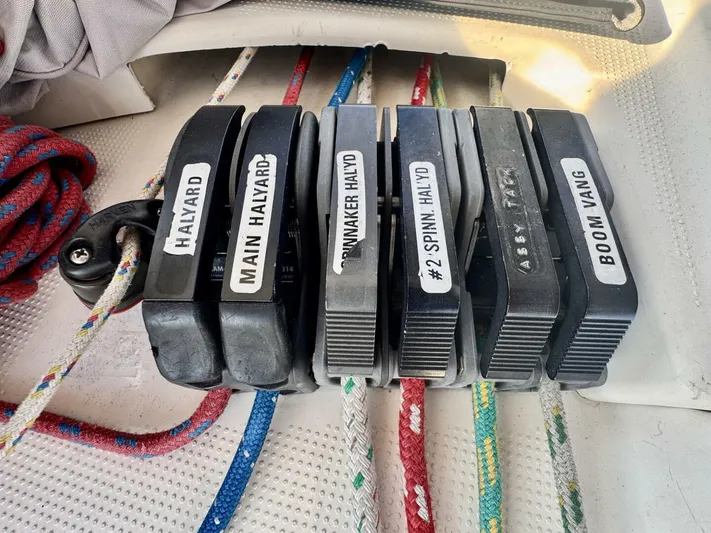  Yacht Photos Pics Sailboat rope clutches labeled for halyards and boom vang on a 1991 Beneteau 45 First.