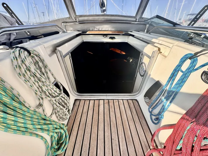  Yacht Photos Pics Cockpit of 1991 Beneteau 45 First sailboat with ropes and wooden flooring.