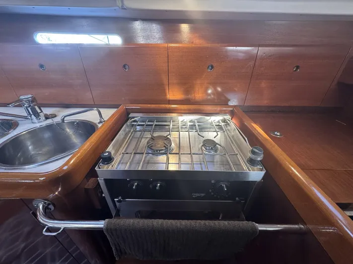  Yacht Photos Pics Galley kitchen in 1991 Beneteau 45 First sailboat with stove and sink.
