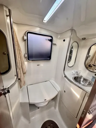 Yacht Photos Pics Bathroom interior of a 1991 Beneteau 45 First yacht, featuring a compact design.