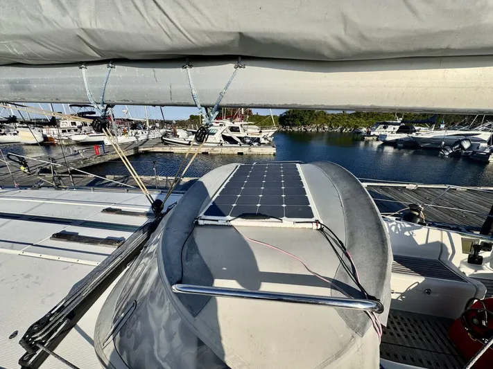  Yacht Photos Pics Sailboat Beneteau 45 First (1991) with solar panel, docked at marina.